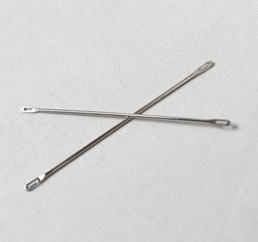 Aiguille double chas